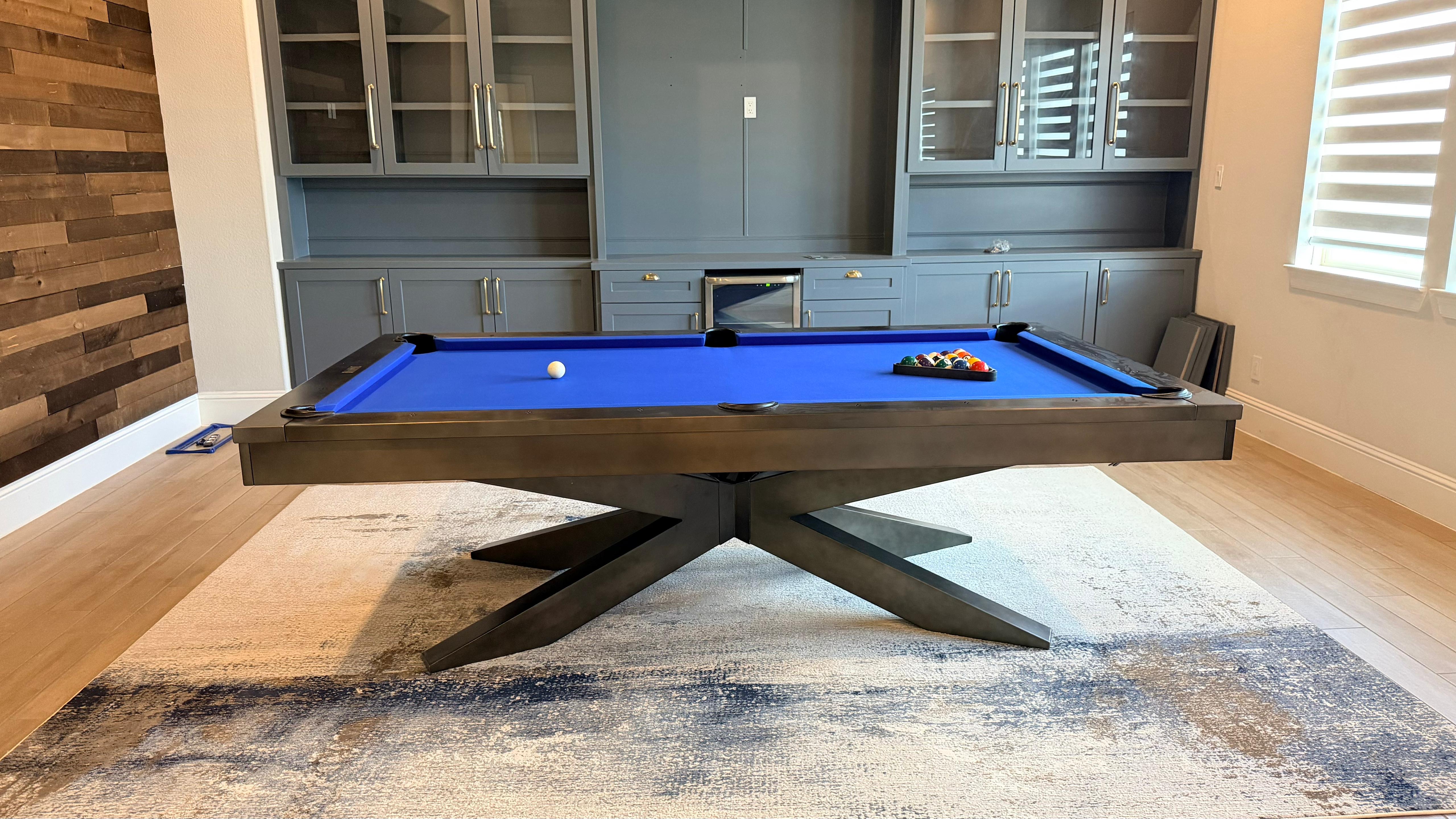 Professional pool table installation in a game room