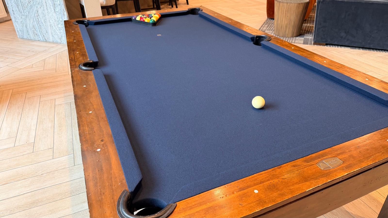 Pool table rail cushion and felt closeup
